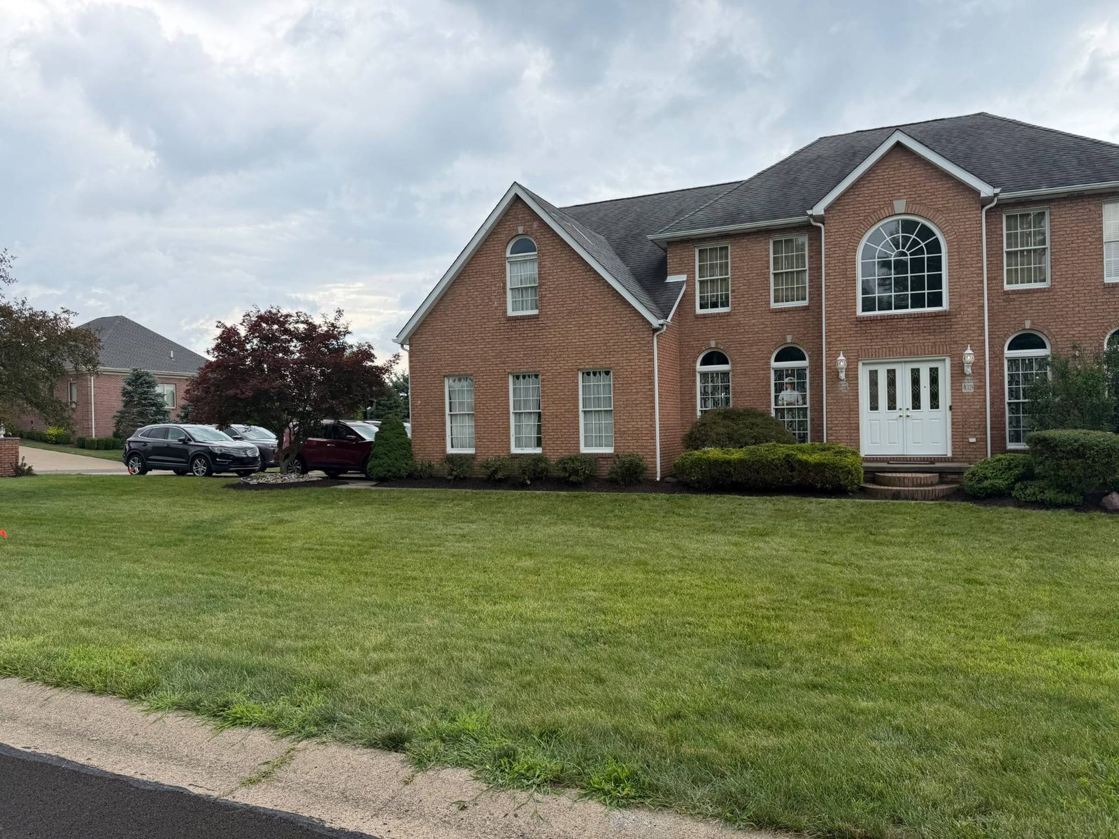 Residential landscaping with mulch beds and mailbox planting